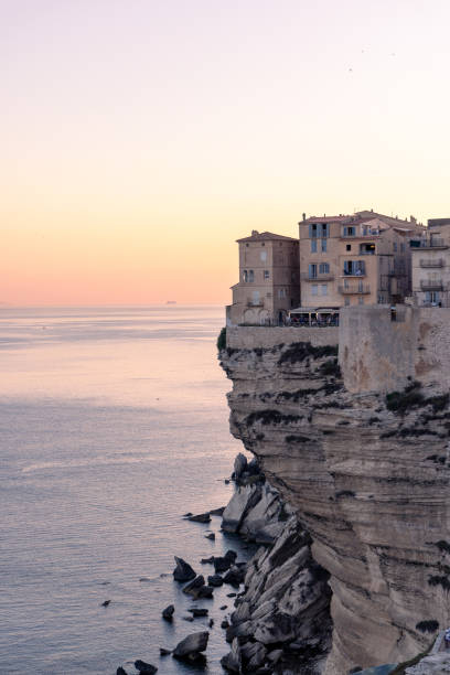 istock Cliffside Buildings Overlooking the Sea at Sunset 2176619181