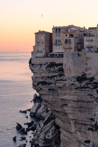 istock Cliffside Buildings Overlooking the Sea at Sunset 2176619184