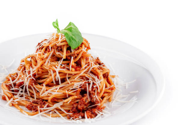 istock Spaghetti bolognese with parmesan cheese and basil on white plate 2176625896