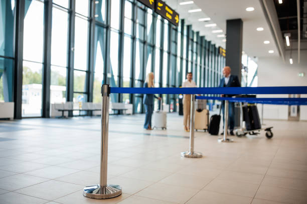 istock People traversing an airport terminal 2176626432