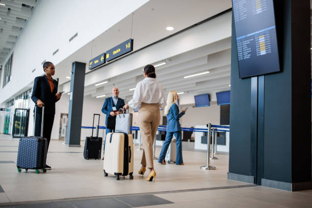 istock People traversing a modern airport terminal 2176626787
