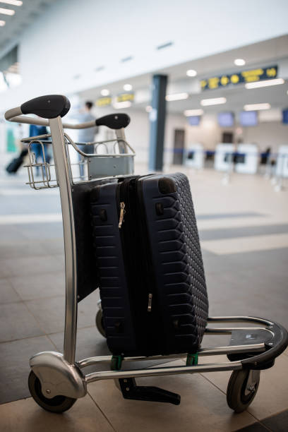 istock Suitcase on a luggage cart 2176626822