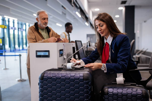 istock Senior man at baggage control in an airport 2176627843