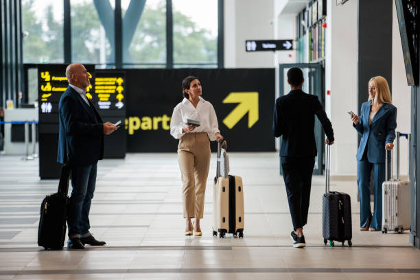 istock People traversing a modern airport terminal 2176629116