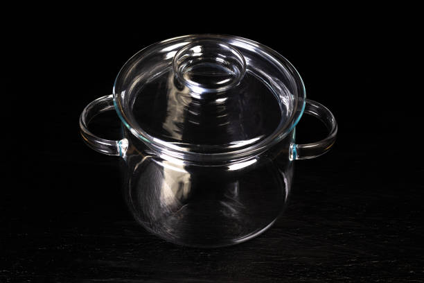 Modern stock cooking pot made from tempered glass. Beautiful creative kitchenware in which you can see process of preparing your food.