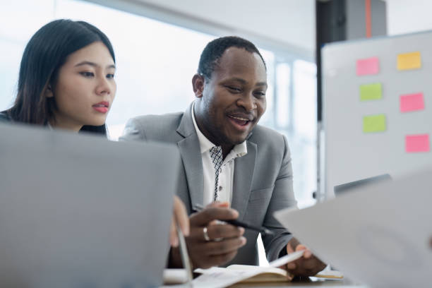 istock Professional Business Meeting with Diverse Team Collaborating on Project in Modern Office Setting 2176630548