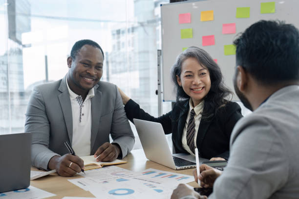 istock Professional Business Meeting with Diverse Team Collaborating in Modern Office Environment 2176630586