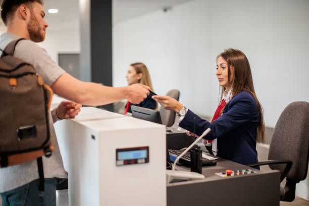 istock Young man checking in at an airport 2176630625