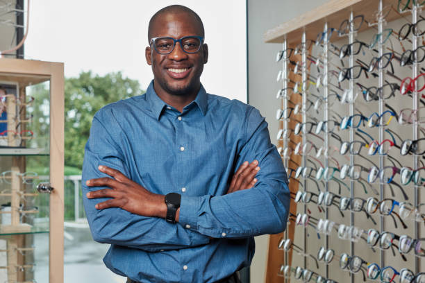istock Confident Optometrist Business Owner Standing in Eyeglass Store Displaying Spectacles 2176630693