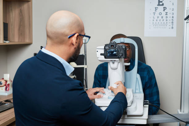 istock Optometrist Conducting Vision Examination Using Advanced Equipment in Modern Clinic Setting 2176631575