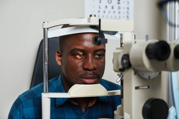 istock Optometrist Conducting Eye Examination with Advanced Equipment in a Modern Office Setting 2176631747