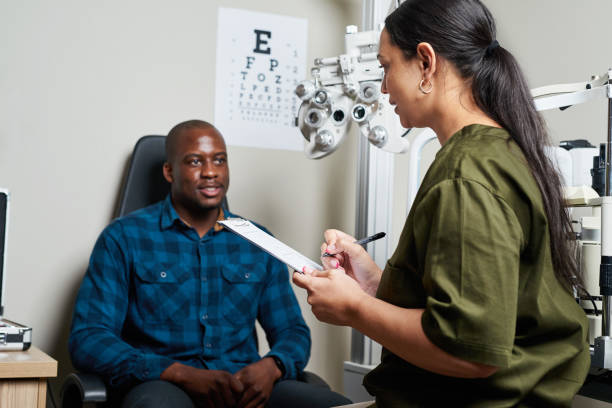 istock Optometrist Conducting Eye Exam for Patient in Professional Clinic Setting Featuring Modern Equipment 2176632418