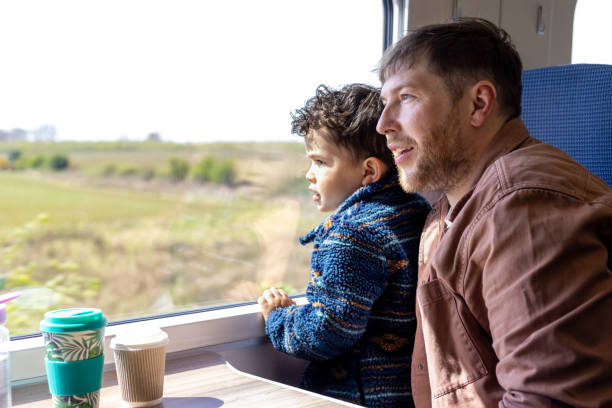 istock Father and Son Admiring Scenic Views from the Train 2176632451