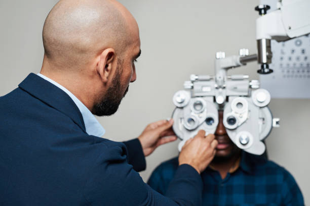 istock Optometrist Conducting Eye Exam with Advanced Equipment in Professional Setting 2176632468