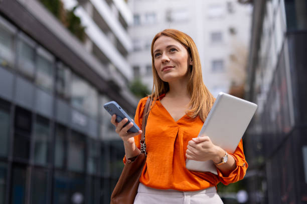 Elegant businesswoman using her phone