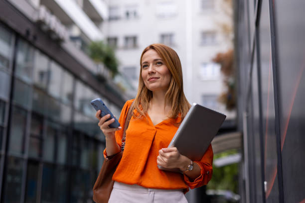 istock Elegant businesswoman using her phone 2176633316