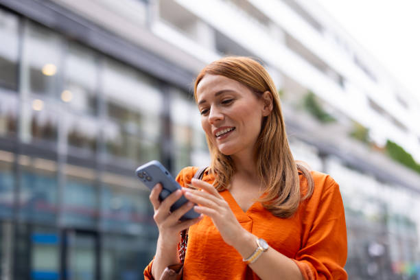 istock Elegant businesswoman using her phone 2176633911