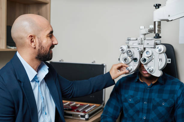 istock Professional Optometrist Conducting Eye Examination With Advanced Equipment in Optometry Office Setting 2176635828