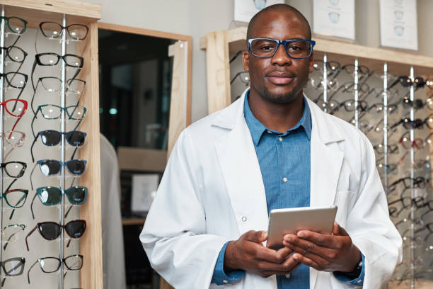istock Confident Optometrist Business Owner Standing with Tablet in Eyeglass Store Displaying Spectacles 2176637431