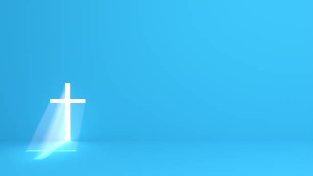 catholic cross with intense light and mist - blue background