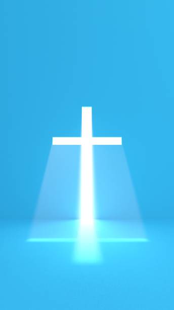 istock catholic cross with intense light and mist - blue background 2176640202