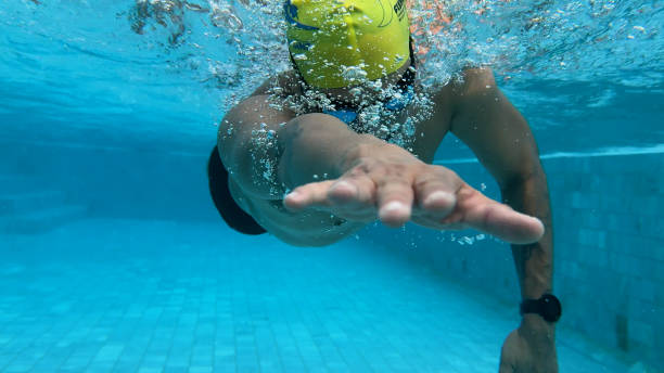 istock Asian man in swimming pool, swimmer triathlon exercising and training, 2176640244