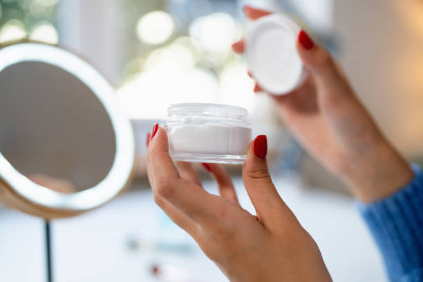 istock An unrecognizable woman opening a jar of moisturizing cream 2176641066