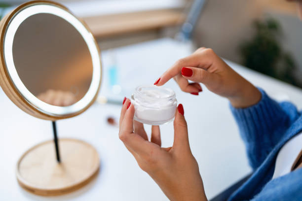 istock Woman holding a jar of moisturizing cream 2176641101
