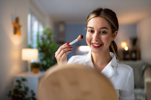 istock Young woman doing make-up at home 2176641282