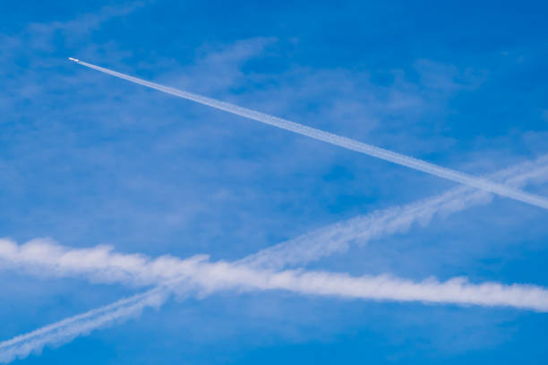White blue sky etude, White traces of airplanes in blue sky