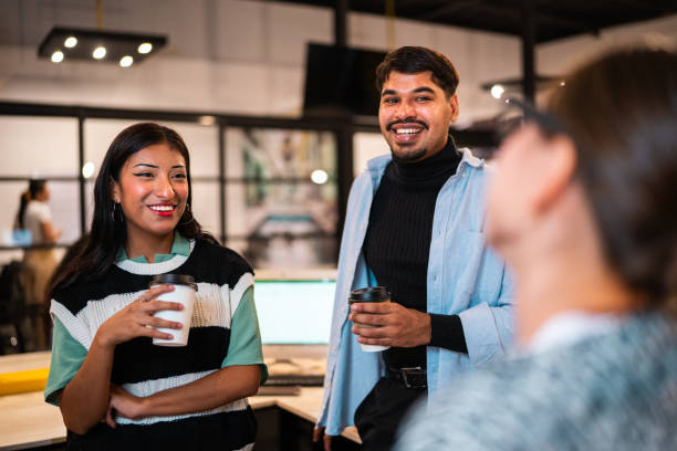 istock Coworkers talking at office 2176645635