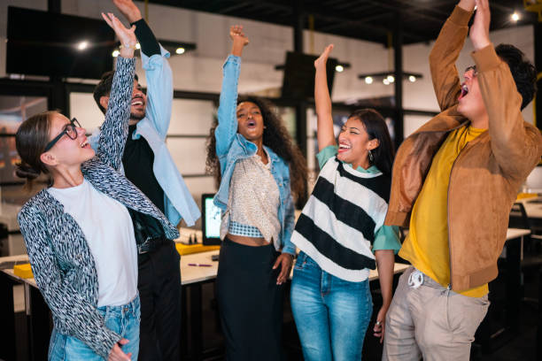istock Young coworkers with hands clasped at office 2176645725