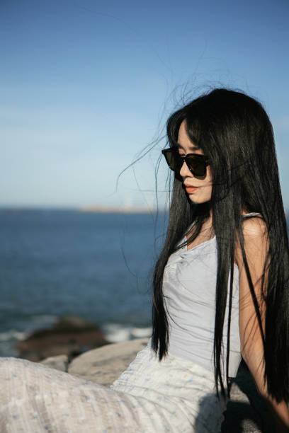 istock Asian beauties traveling by the seaside 2176646822