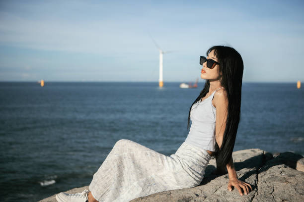 Asian beauties traveling by the seaside