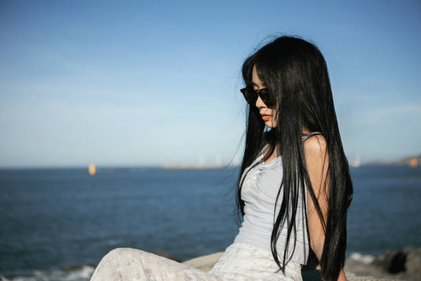 istock Asian beauties traveling by the seaside 2176646827
