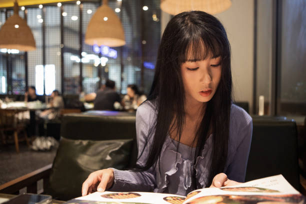 istock Asian women reading menus in restaurants 2176646974