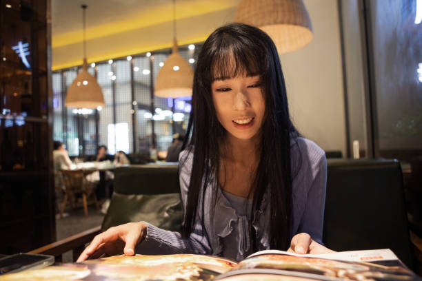 istock Asian women reading menus in restaurants 2176646982
