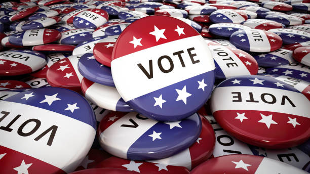 istock Large pile of red, white, and blue Vote buttons. 2176649385