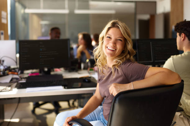 istock Happy female designer enjoying while working in the office. 2176650922
