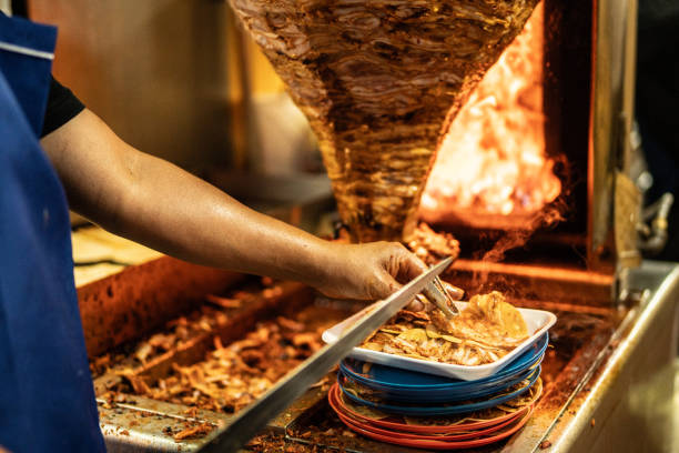 Close-up of man cutting doner kebab
