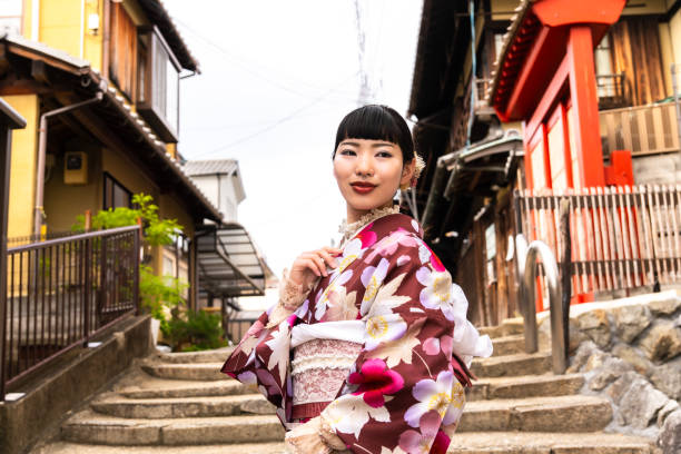 istock A woman in a kimono walking around town 2176660456