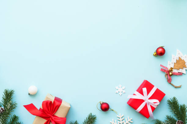 istock Christmas present box and decorations at blue. 2176661951