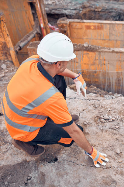 istock Construction worker working on a public city road reconstruction. 2176664042