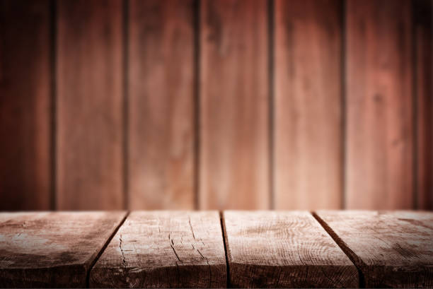 istock Empty wooden table with defocused wooden background 2176664384