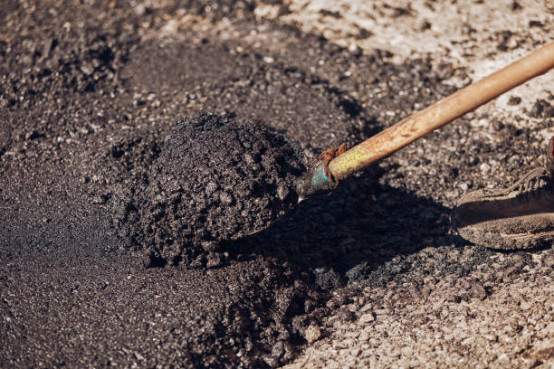 istock Shovel with fresh asphalt on a public street reconstruction. 2176664568