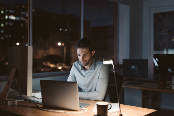 istock Young businessman working late at night in an office 2176665815