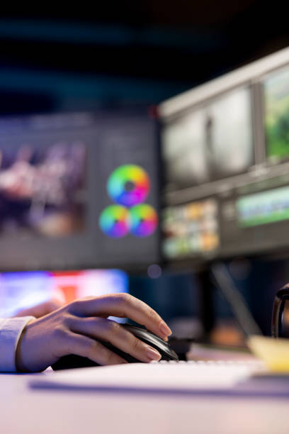 istock Videographer splicing film pieces, editing them, close up 2176670482