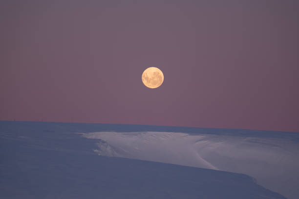 istock Full yellow moon in Antarctica. Night 2176671039