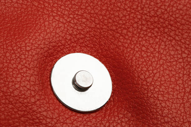 metal button closure on red leather clothing