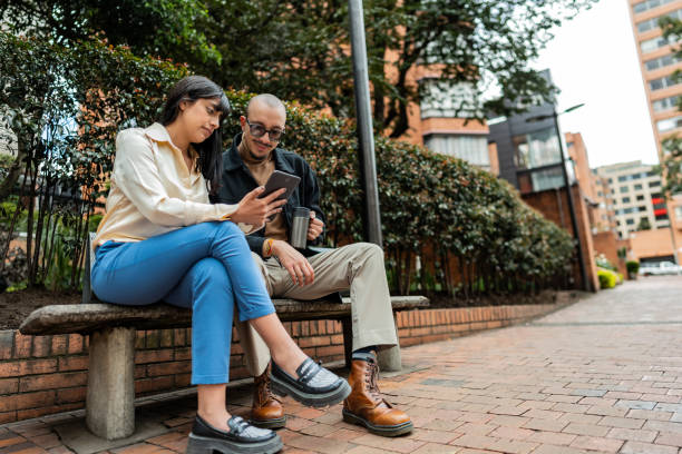 istock Coworkers using digital tablet in the city 2176672191